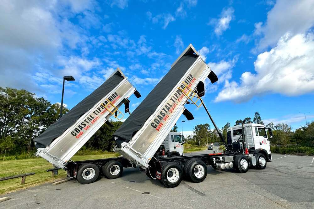 two City Fleet Citrak tippers in tipping motion